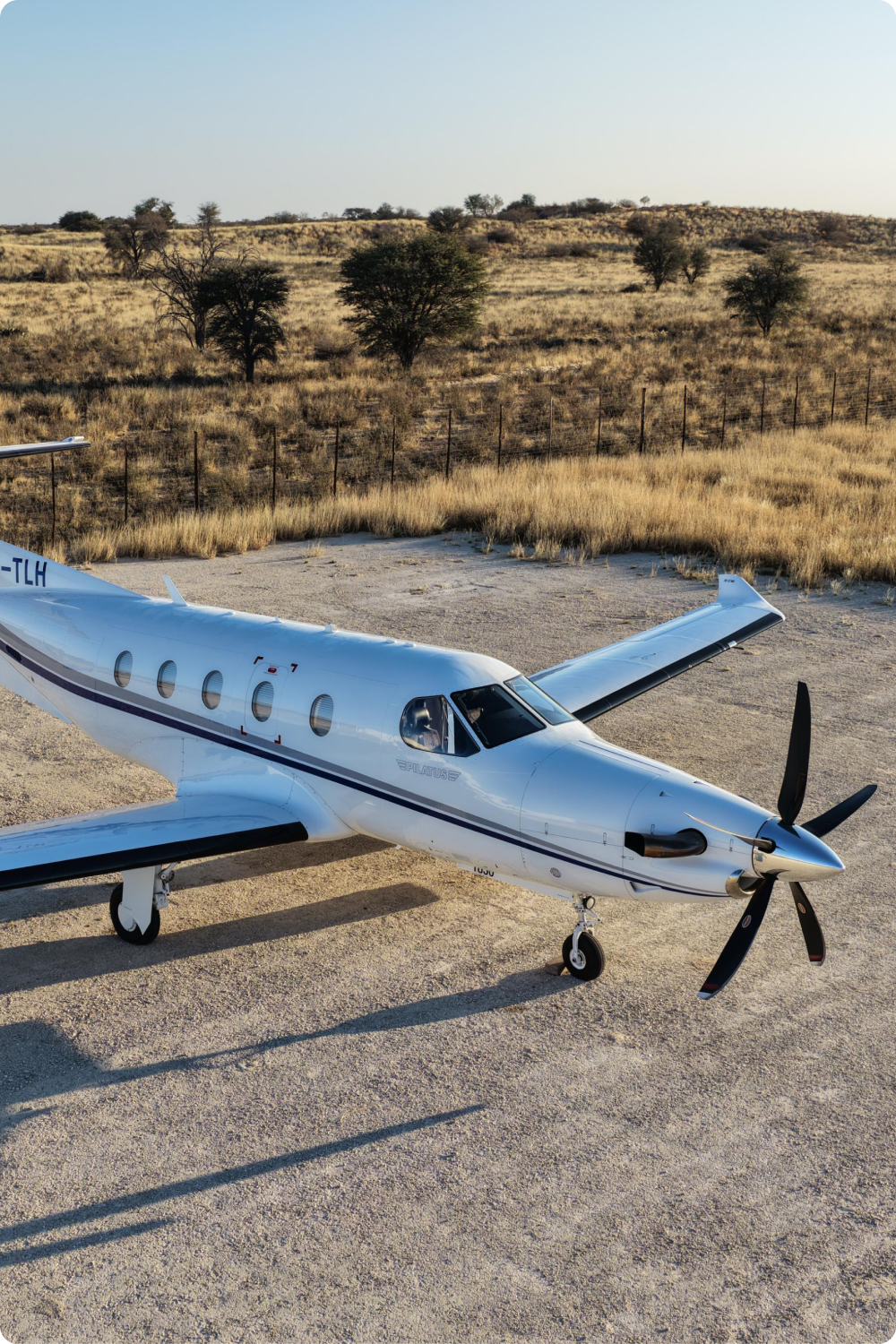 Turboprop on a gravel apron in the bushveld