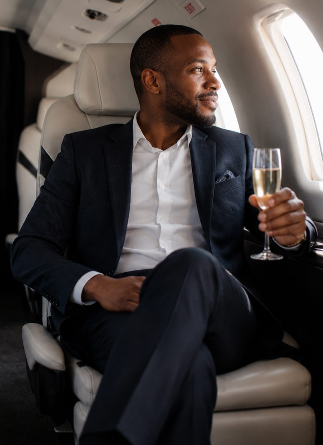 Passenger relaxing on board a private jet