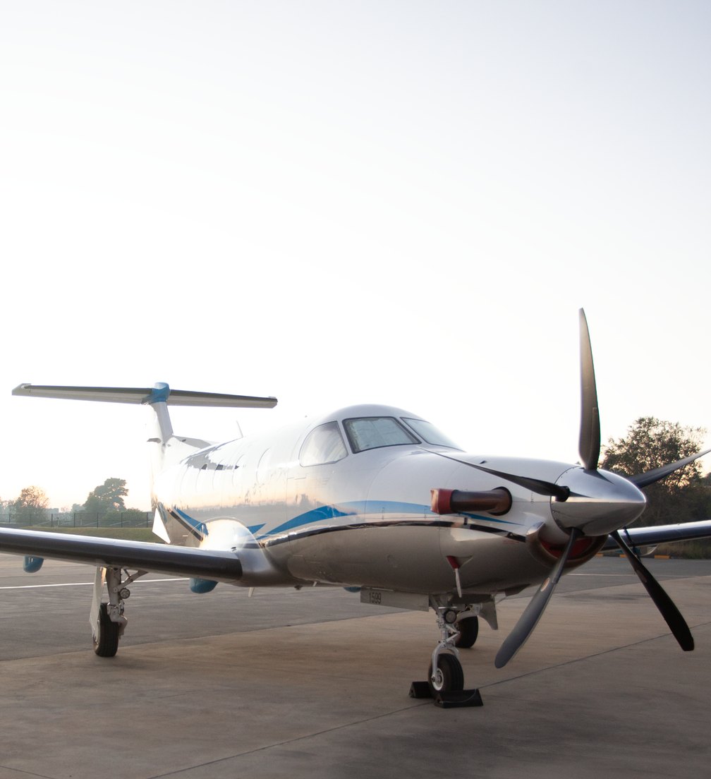 Turboprop aircraft parked on a remote airstrip